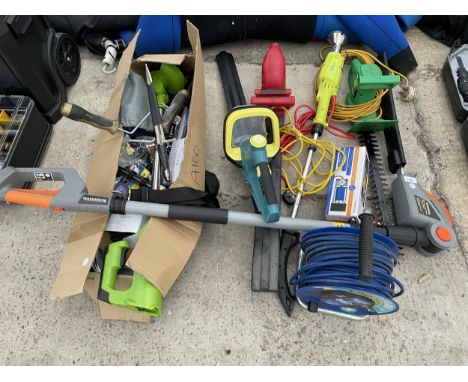A LARGE ASSORTMENT OF GARDEN TOOLS TO INCLLUDE ELECTRIC HEDGE TRIMMERS AND STRIMMERS ETC 