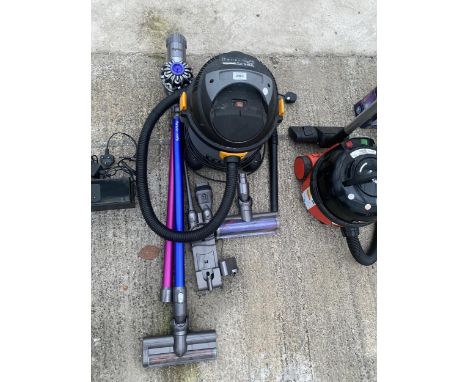 A DYSON STICK VACUUM AND A TITAN VACUUM CLEANER 