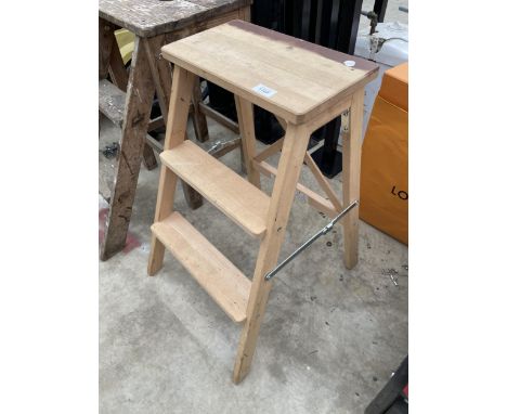 A SMALL WOODEN TWO RUNG STEP SEAT 