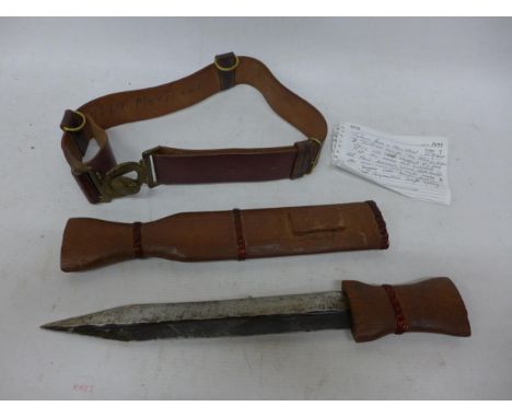 A KENYAN MAU MAU KNIFE, CIRCA 1952, 27CM DOUBLE EDGE BLADE, WOODEN GRIP AND SCABBARD, BRITISH SOUTH AFRICAN POLICE BELT AND B