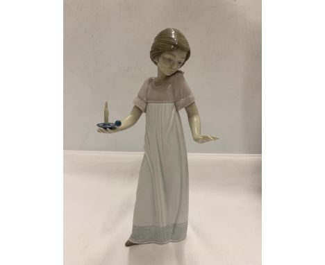 A NAO FIGURE OF A GIRL HOLDING A CANDLE 