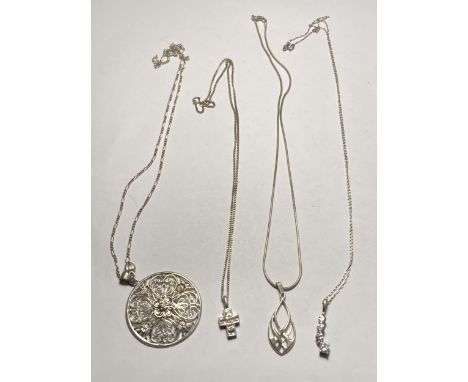 FOUR ASSORTED SILVER NECKLACES WITH PENDANTS 