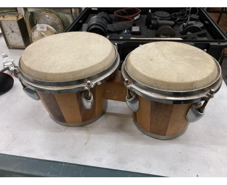 A PAIR OF WOODEN BONGO DRUMS 