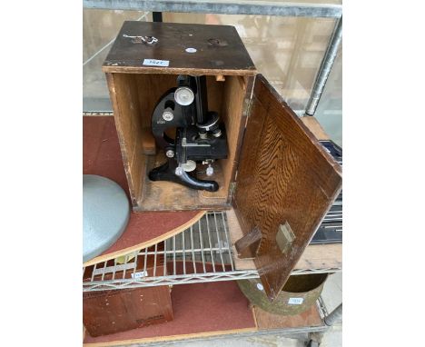A VINTAGE R J BECK LTD MICROSCOPE WITH WOODEN CARRY CASE 