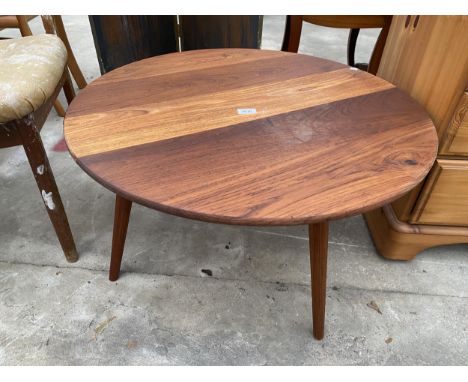 A 30" DIAMETER ERCOL STYLE COFFEE TABLE ON TAPERING LEGS 