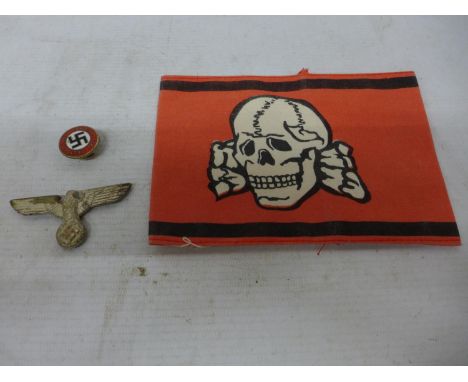 A NAZI GERMANY BADGE, ENAMEL PARTY BADGE AND AN ARM BAND 