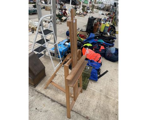 A LARGE WOODEN ARTISTS EASEL 