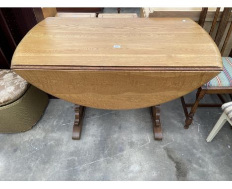 AN ERCOL ELM DROP-LEAF DINING TABLE, 50 X 46" OPEN 