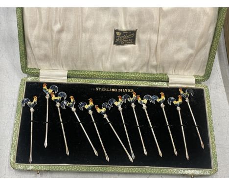 A CASED SET OF STERLING SILVER AND ENAMEL COCKEREL COCKTAIL STICKS 