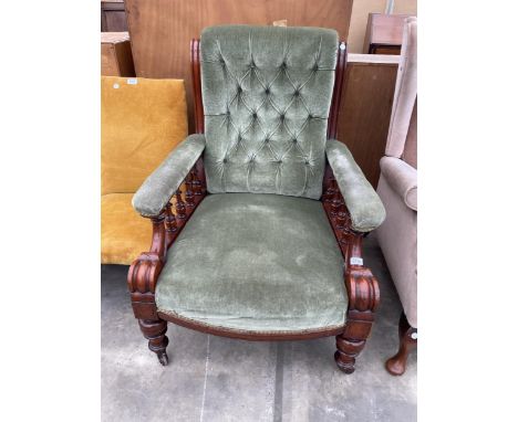 A VICTORIAN MAHOGANY LOUNGE CHAIR WITH BUTTON BACK, TURNED FRONT LEGS AND UPRIGHTS 
