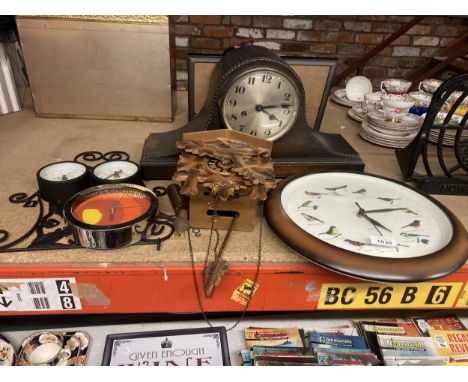 A VINTAGE MAHOGANY NAPOLEON'S HAT MANTLE CLOCK, A CUCKOO CLOCK, A WALL CLOCK WITH BIRD DECORATION PLUS TWO OTHER WALL CLOCKS 