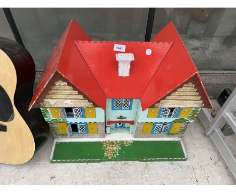 A VINTAGE WOODEN DOLLS HOUSE 