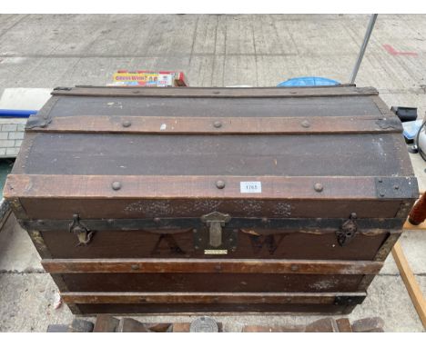 A VINTAGE WOODEN DOME TOP TRUNK BEARING THE LABEL TODD BROS 