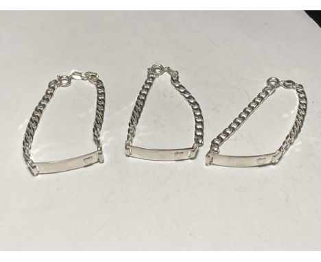 THREE SMALL SILVER I.D BRACELETS 