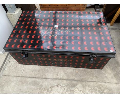 A METALWARE NIGER SCHOOL TRUNK WITH INTERNAL MIRROR, PAINTED BLACK WITH RED MOON CRESCENTS 