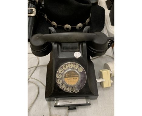 A VINTAGE BAKELITE TELEPHONE WITH PULL OUT TRAY AND HOLMES CHAPEL NUMBER 