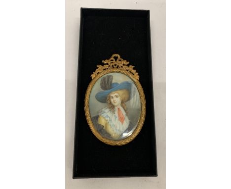 AN ANTIQUE (APPROX 1870) GILT FRAMED PORTRAIT MINIATURE OF A LADY, LABEL TO REVERSE, LENGTH 11CM 