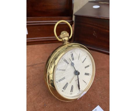 A BRASS QUARTZ ALARM CLOCK IN THE FORM OF A POCKET WATCH 