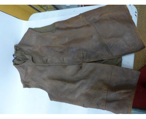 A WORLD WAR II BRITISH ARMY LEATHER JERKIN DATED DECEMBER 1942 