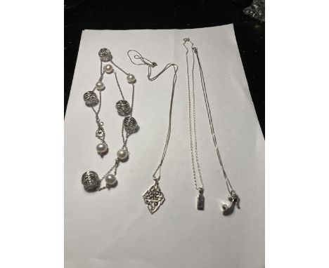 FOUR ASSORTED SILVER NECKLACES THREE WITH PENDANTS 