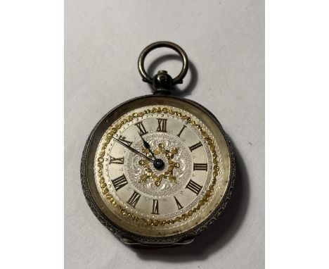 A LADIES SILVER FOB WATCH WITH DECORATIVE FACE 