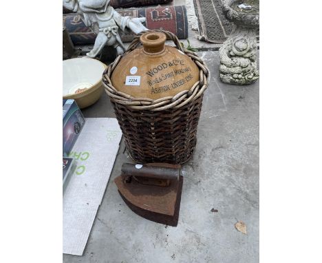 A LARGE VINTAGE FLAT IRON AND A STONEWARE FLAGGON 