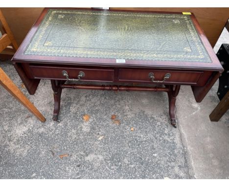 A LOW MAHOGANY SOFA TABLE WITH INSET LEATHER TOP WITH LYRE ENDS 