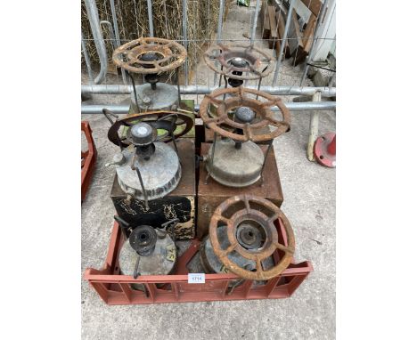SIX VINTAGE PARAFIN STOVES AND CASES 