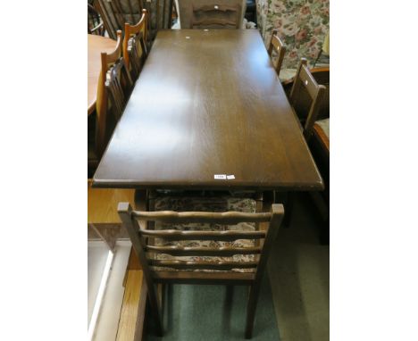 An oak refectory dining table, 77cm high x 168cm wide x 76cm deep with a pair of ladder back carvers and two pairs of chairs 