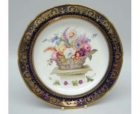 A SWANSEA PORCELAIN SHALLOW DISH FOR THE 'LYSAGHT' SERVICE the interior decorated with a large basket of garden flowers on a 