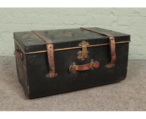 A vintage tin trunk. The clasp marked for Bates, Wolverhampton.  