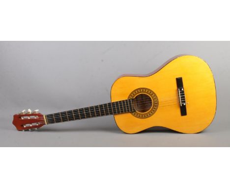 A Herald acoustic guitar, model HL34.  
