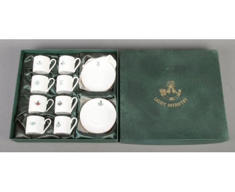 A boxed Impamark Ltd made 'Light Infantry' presentation Fine Bone China tea service. Containing eight cups and saucers each s