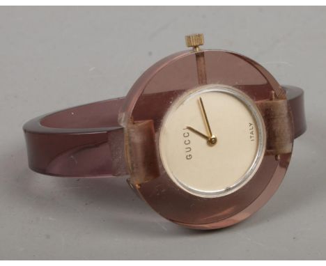 A ladies lucite manual Gucci wristwatch. 17 jewel movement.  