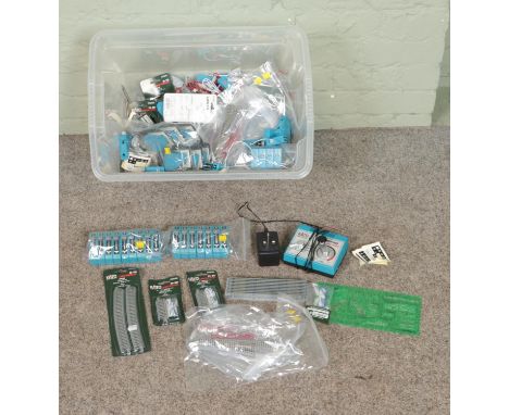 A box of Kato Unitrack for N Gauge model railway. Includes cables, boxed and unboxed track, Power Pack and several Turnout Co