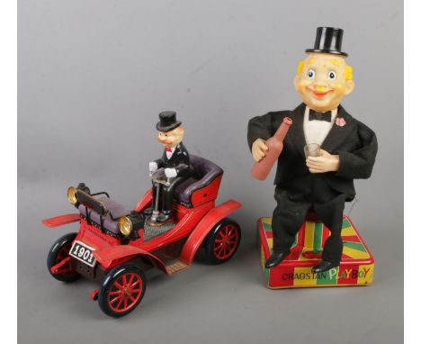 Two vintage Cragstan battery operated tinplate toys to include Old-Timer Car and Playboy Bartender.  