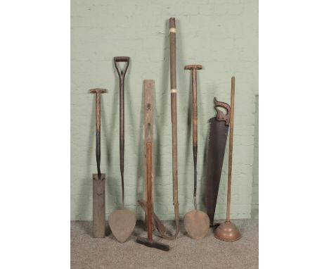 A collection of vintage tools including drain spade/trenching spade, spirit level, spike maul etc  