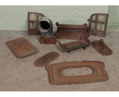 A collection of cast iron fire grate spares to include decorative floral examples.  