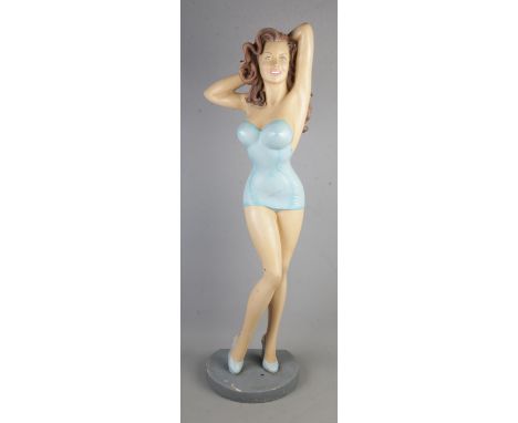 A 1950's Jantzen Girl swimsuit display figure, modelled standing in blue shoes and one piece bathing suit,  Crack along leg