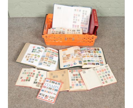 A large collection if stamps from around the world in several albums including the complete guide to stamps and stamp collect