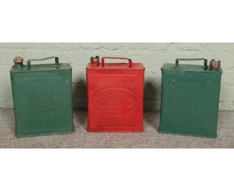 Three vintage petrol cans; Pratts, Shell and Esso.  