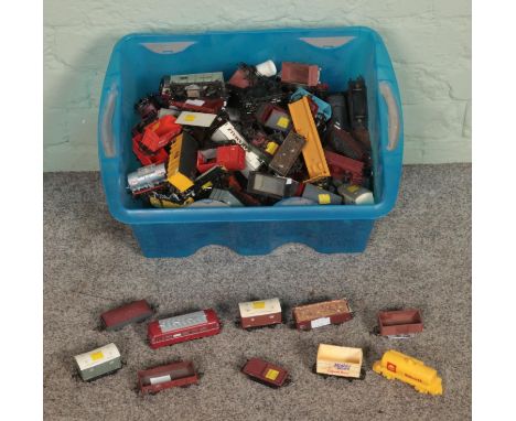 A box of assorted model railway stock of mostly OO Gauge to include carriages, wagons and tankers.  