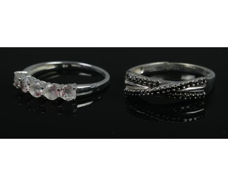 Two 9ct white gold rings one set with black diamonds, one with astraeolite stones. Each with certificates of authenticity. Bo