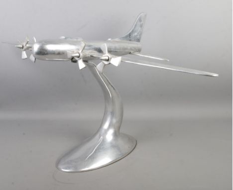 A large chromed model of a four engine plane. 40cm high.  