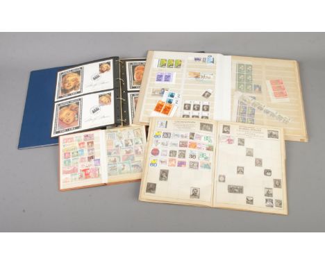 A collection of partially filled world stamp albums to include Marilyn Monroe first day covers, unfranked examples, Stars of 