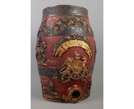 A painted stoneware spirit keg, decorated with grape vine, men on horseback and lions. With partial label for S. Whiskey. Bea