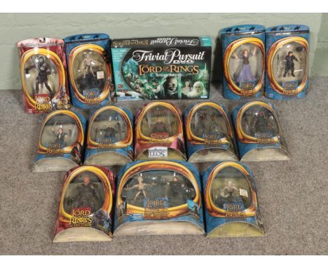 A collection of Toy Biz Lord of the Rings action figures along with a boxed Trivial Pursuit: Lord of the Rings Edition.  