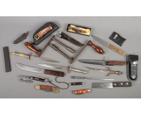 A box of mostly knives and daggers. Includes Will Rodgers, Venture H.M.Slater, winding handles, pocket knives, WWI military p