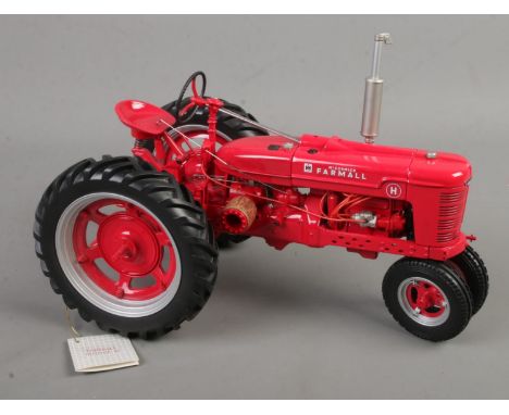 A Franklin Mint 1:12 scale McCormick Farmall Model H tractor.  