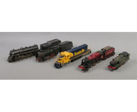 A collection of model railway locomotives to include Kadee Santa Fe, Great Western Railway 6664, Marklin 24056, etc.  